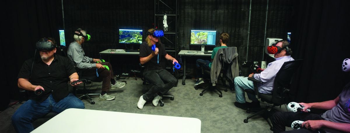 Director Jon Favreau (far left), Deschanel (green VR rig), production designer James Chinlund (blue), Legato (red) and animation supervisor Andy Jones (white) study the previsualized world in preparation for a virtual shoot. “At the end of the day, we. wanted this to be a Caleb Deschanel movie,” director Jon Favreau says. “That’s why I chose him — because of all the inherent challenges that come with creating a so-called ‘live-action’ version of this story. There are some things in the original cartoon version that would be too intense, too graphic, too violent in live-action. But we had Caleb. He’s a person who really understands framing, light and imagery. So he could bring a lot of emotion, and allude to the subject matter while still preserving the tone of a family film. The lyricism he brings to his work really serves the story well.”