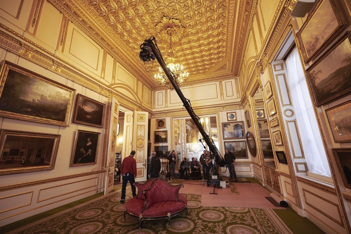 A crane is deployed to shoot an interior scene.